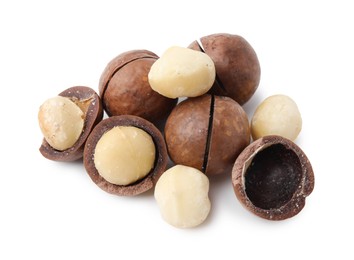 Macadamia nuts with shells isolated on white