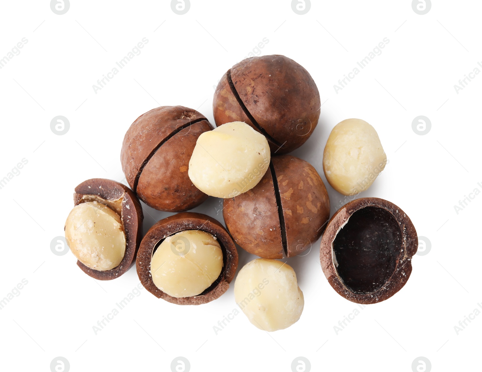 Photo of Macadamia nuts with shells isolated on white, top view