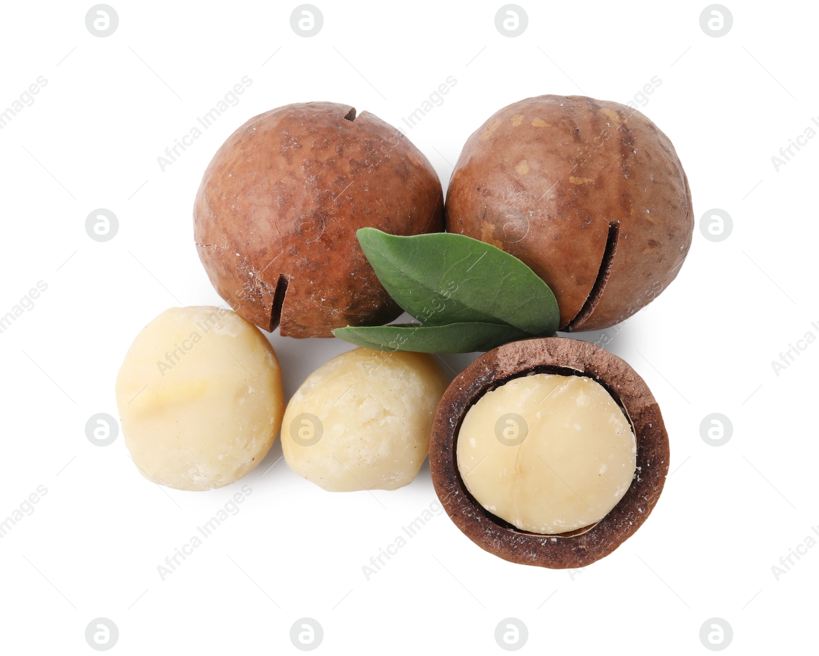 Photo of Macadamia nuts with shells isolated on white, top view