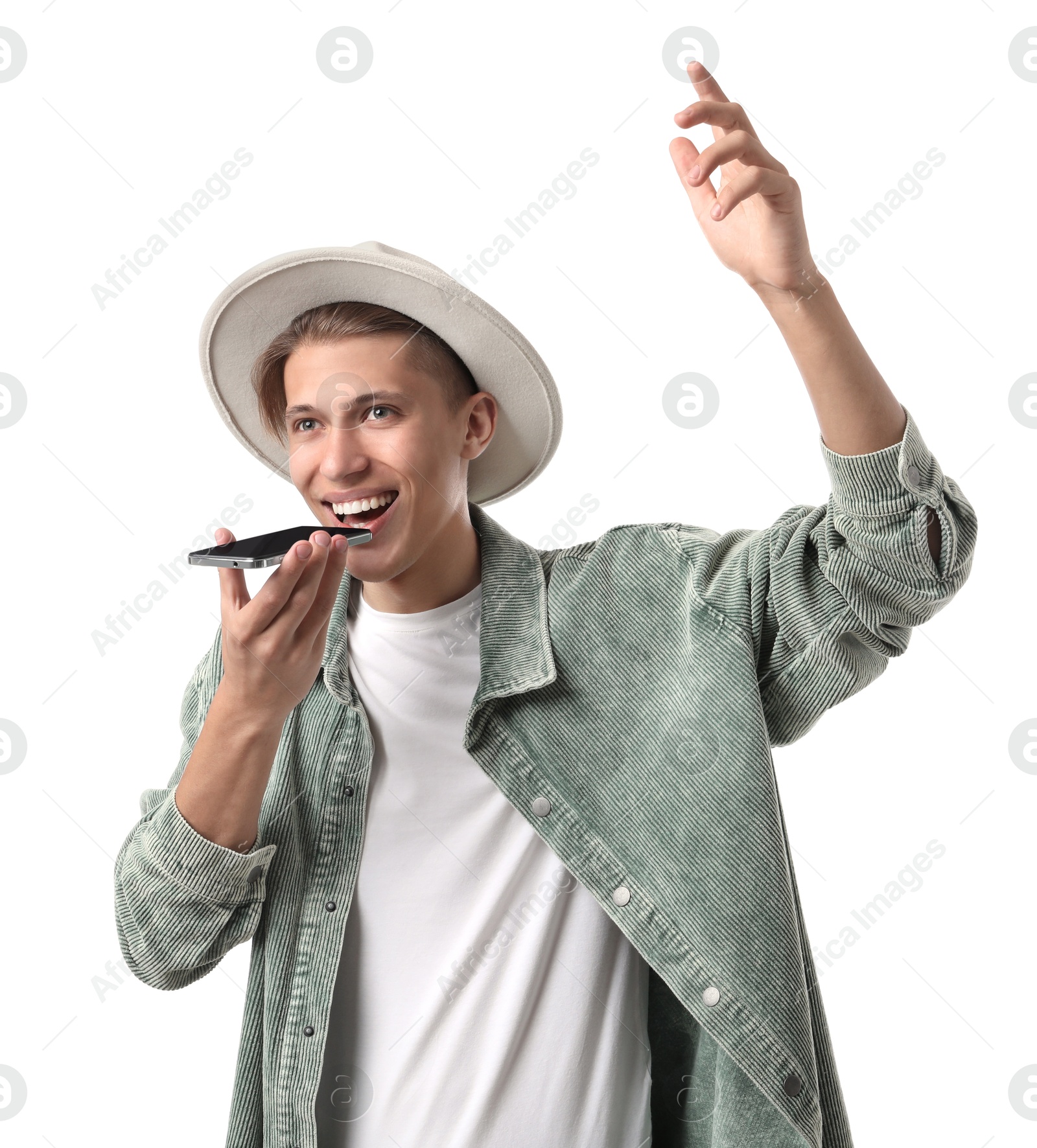 Photo of Young man in hat recording voice message via smartphone on white background