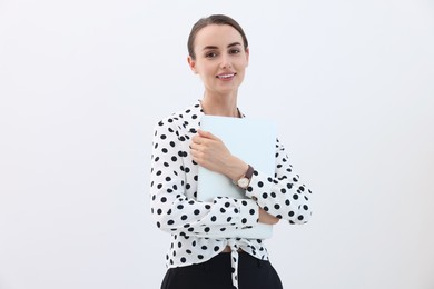 Photo of Portrait of smiling businesswoman with laptop on white background