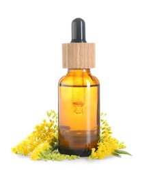 Photo of Bottle of tincture and goldenrods flowers isolated on white