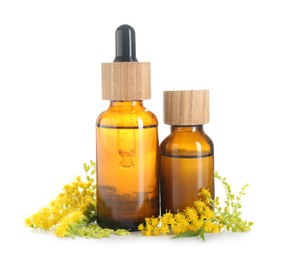 Bottles of tincture and goldenrods flowers isolated on white