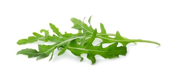 Photo of Many fresh arugula leaves isolated on white