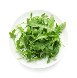 Photo of Plate with fresh arugula leaves isolated on white, top view