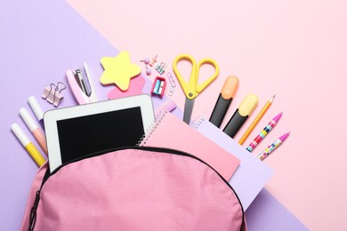 Photo of Backpack and different school stationery on pink background, flat lay. Space for text