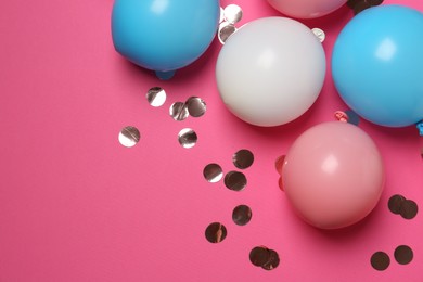 Shiny golden confetti and air balloons on bright pink background, flat lay