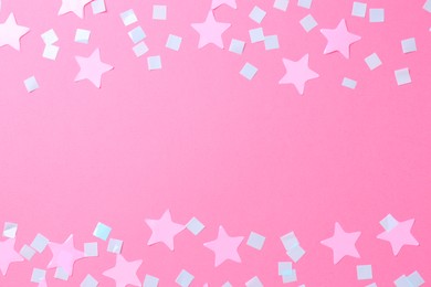 Beautiful confetti on pink background, flat lay. Space for text