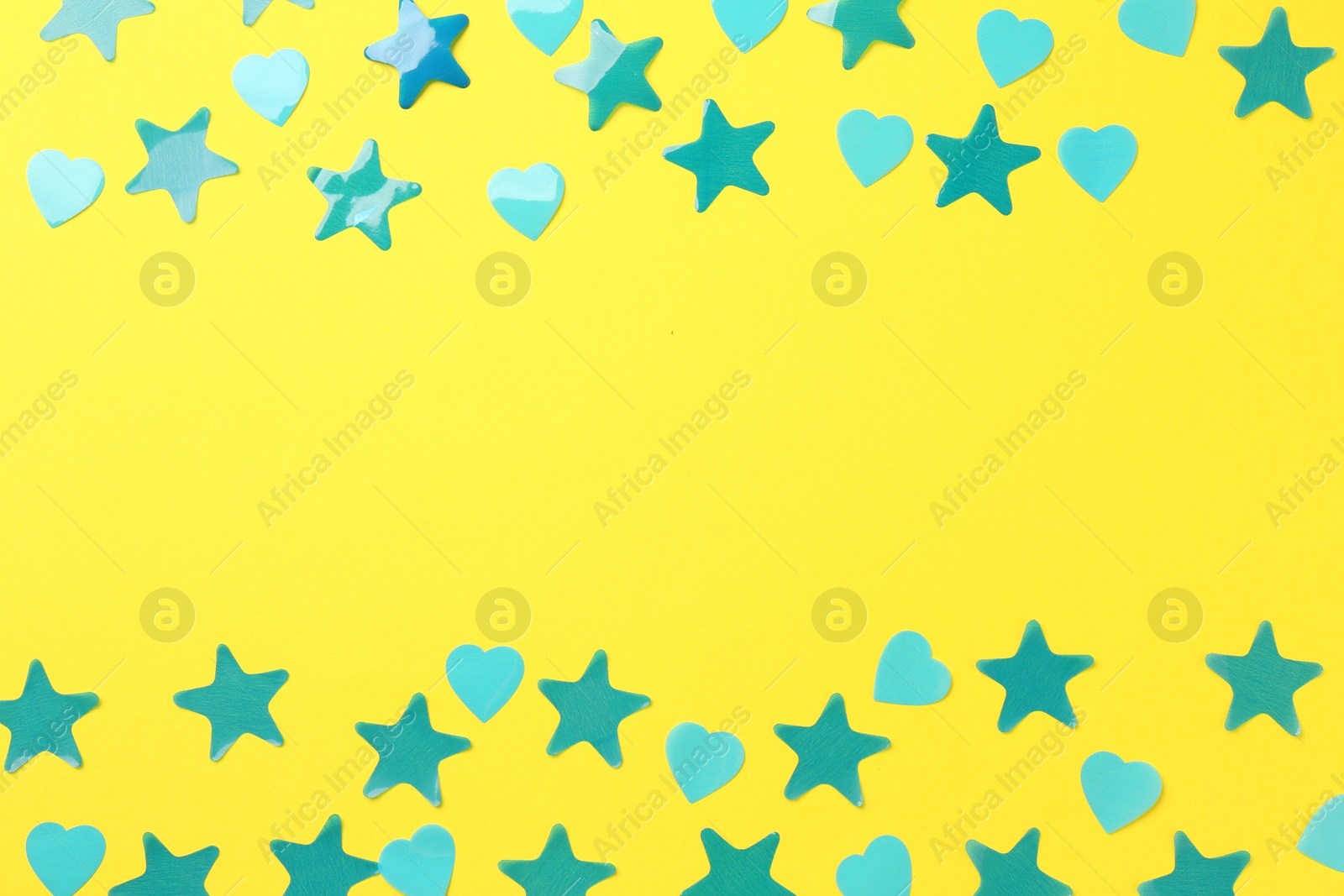 Photo of Beautiful confetti on yellow background, flat lay. Space for text