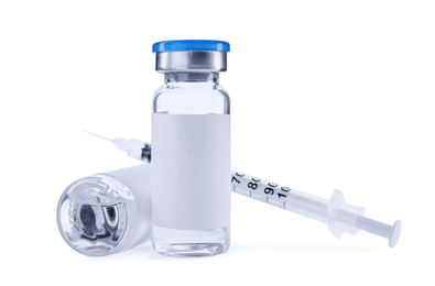 Medication in glass vials and syringe on white background