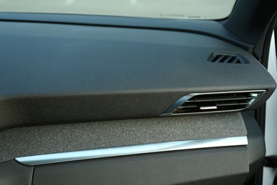 Photo of Modern air vent system inside of car, closeup