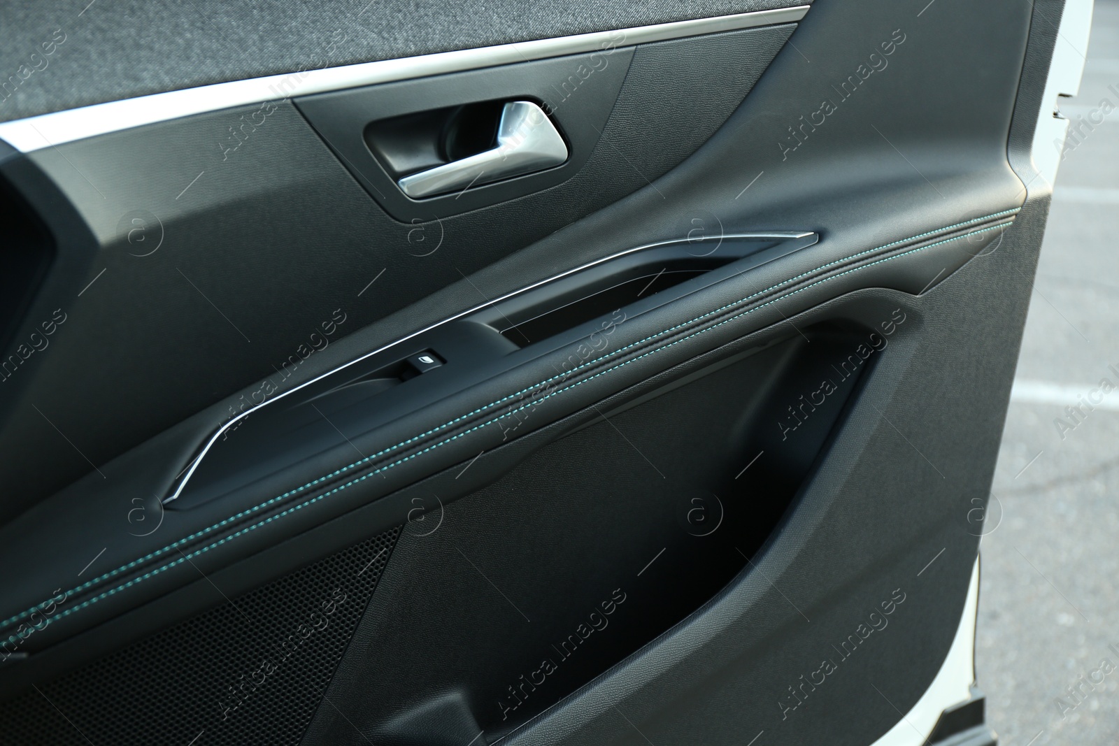 Photo of Closeup view of black car door inside modern automobile