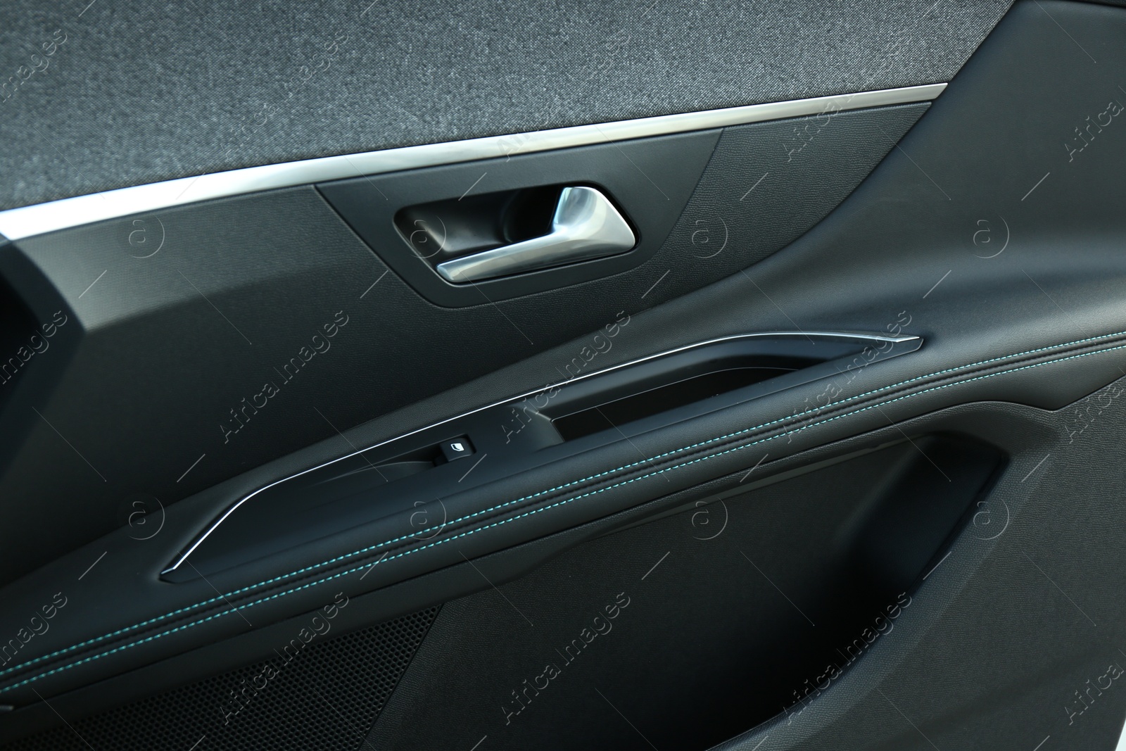 Photo of Closeup view of black car door inside modern automobile