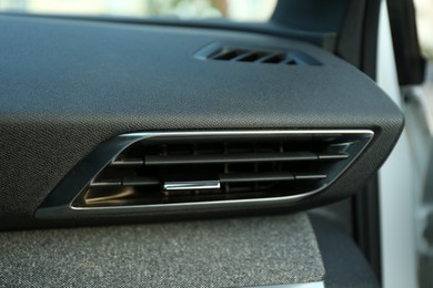 Photo of Modern air vent system inside of car, closeup