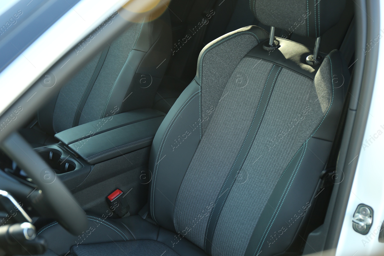 Photo of Comfortable seats inside of modern white car, closeup