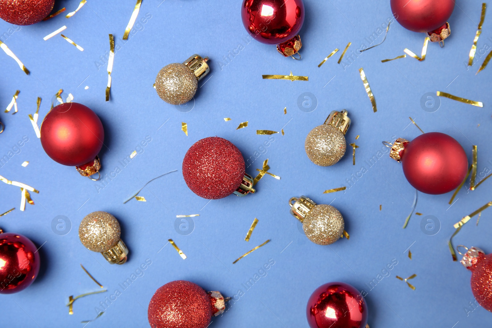 Photo of Flat lay composition with Christmas balls on blue background