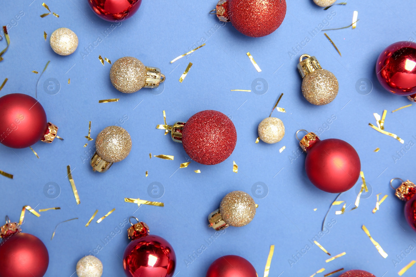 Photo of Flat lay composition with Christmas balls on blue background