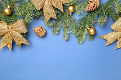 Photo of Flat lay composition with Christmas decor on blue background, space for text