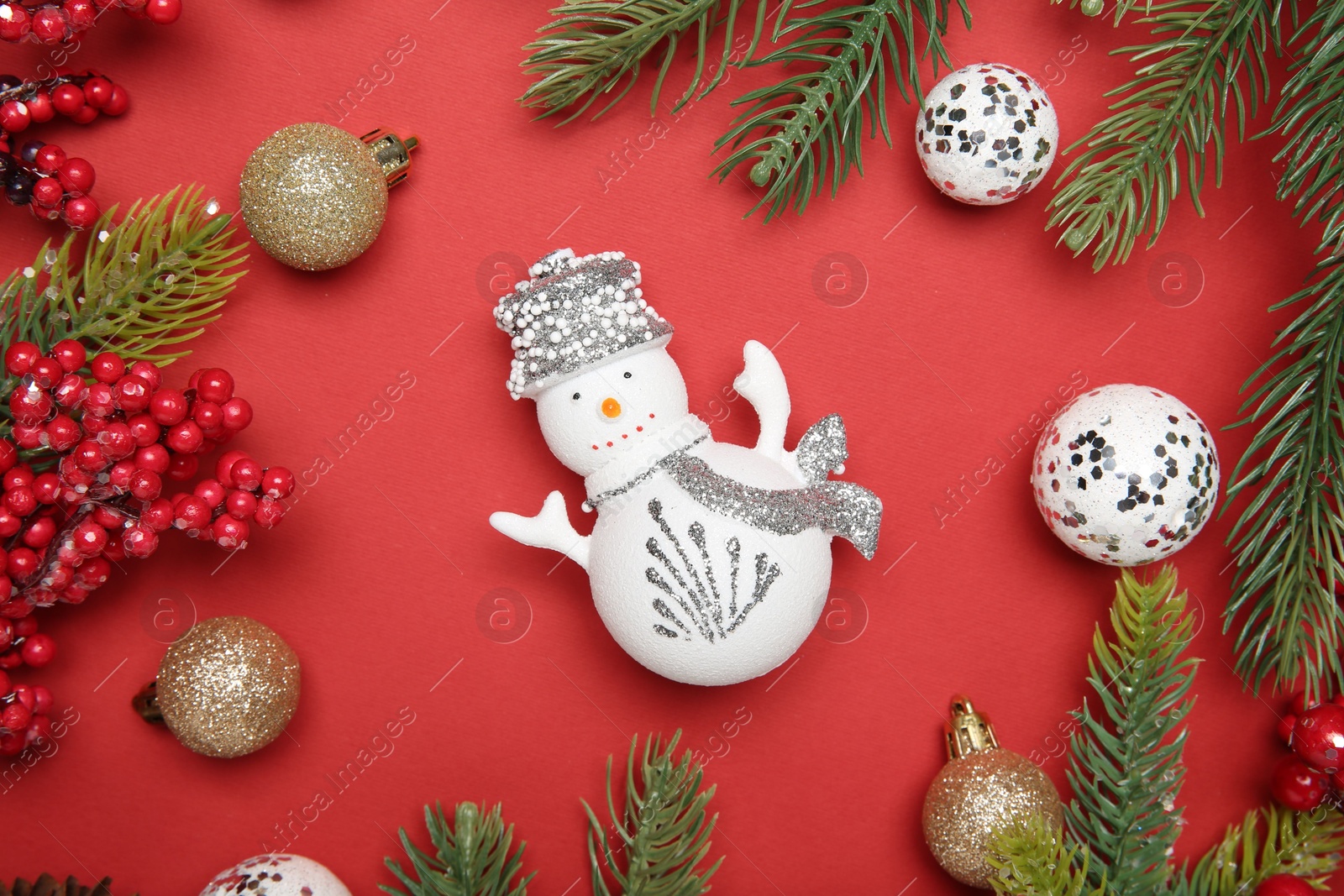 Photo of Flat lay composition with Christmas decor on red background