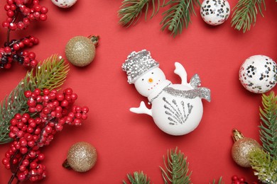 Photo of Flat lay composition with Christmas decor on red background