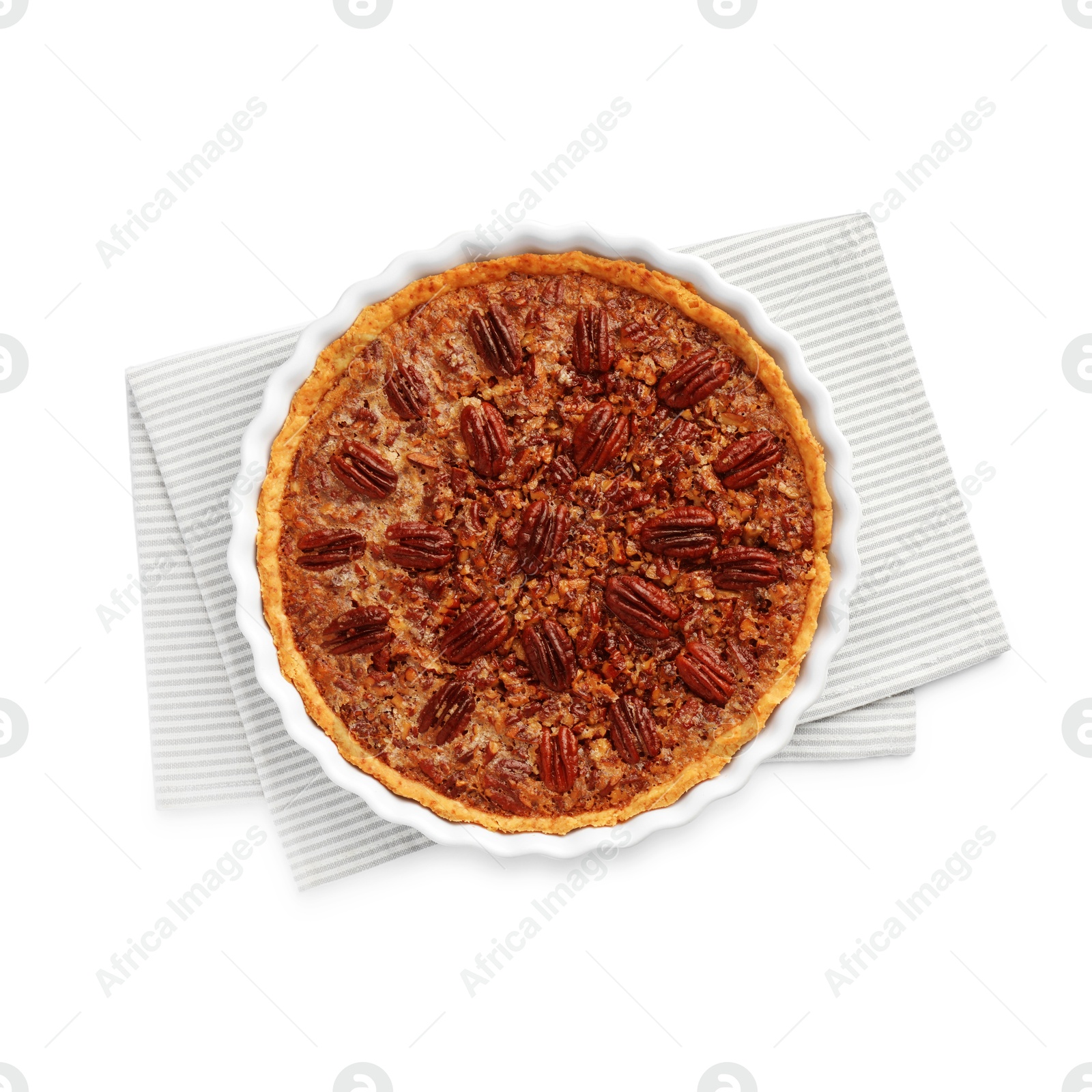 Photo of Delicious pecan pie in baking dish isolated on white, top view