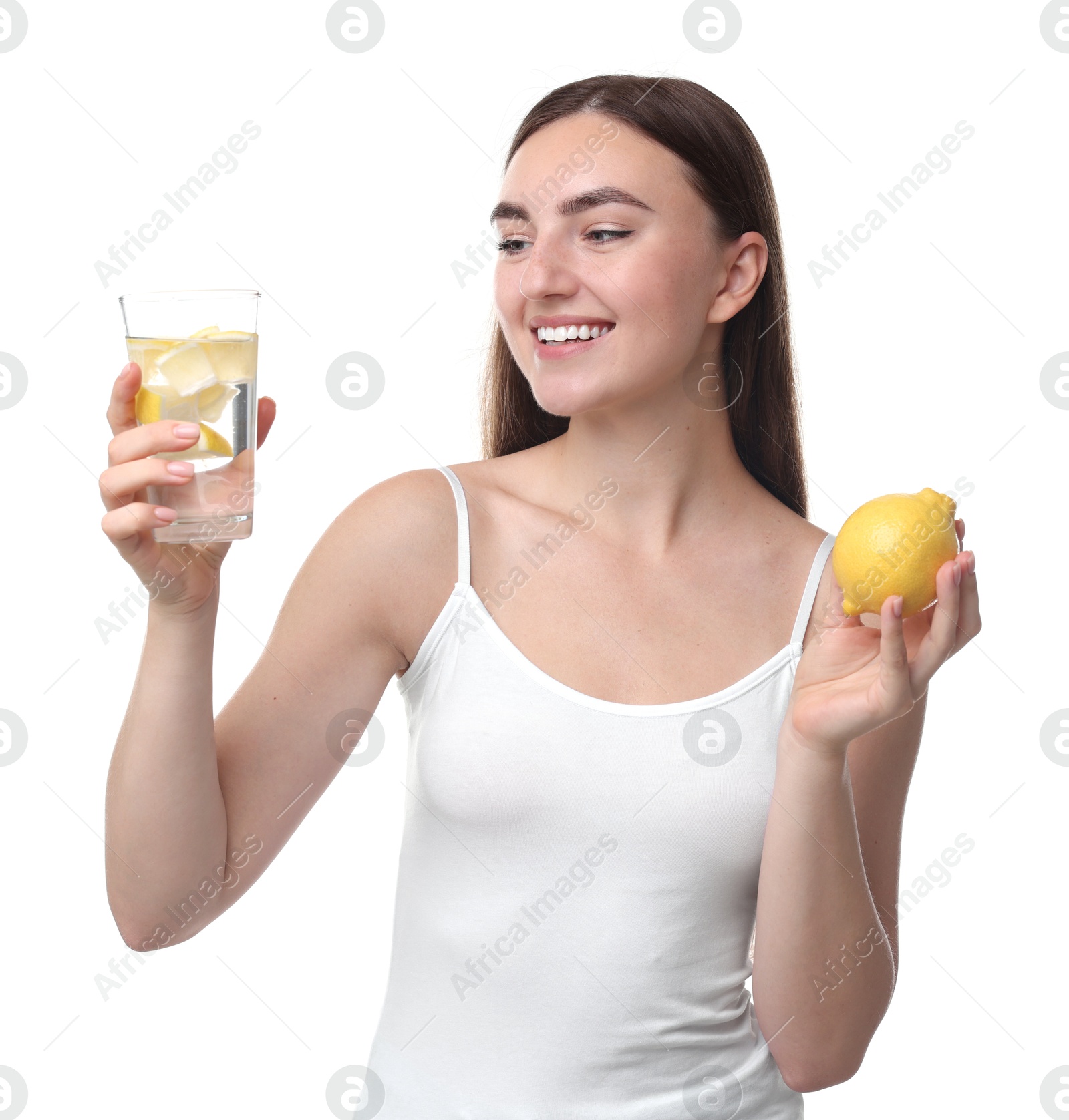 Photo of Woman with glass of lemon water and fruit on white background