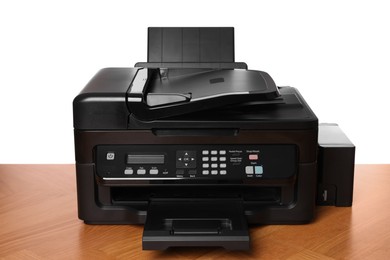 Photo of One modern printer on wooden table against white background