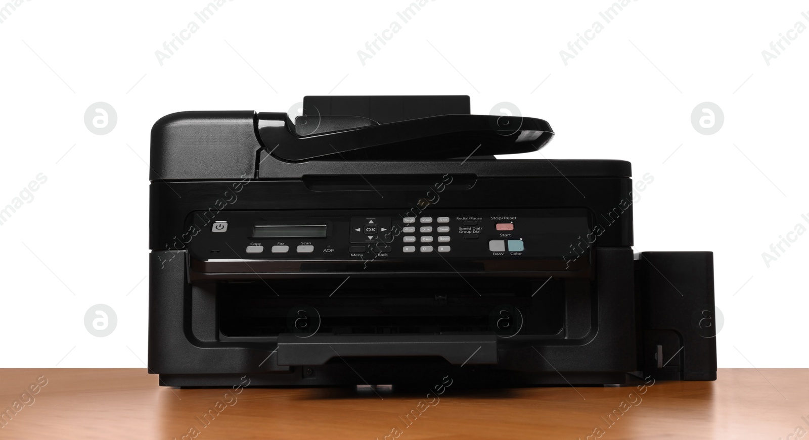 Photo of One modern printer on wooden table against white background