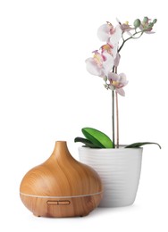 Photo of Aroma oil diffuser and orchid flower isolated on white