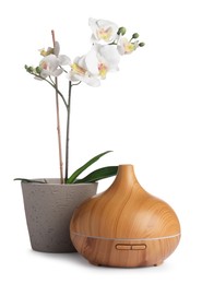 Photo of Aroma oil diffuser and orchid flower isolated on white