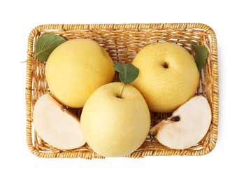 Photo of Delicious fresh apple pears in wicker basket isolated on white, top view