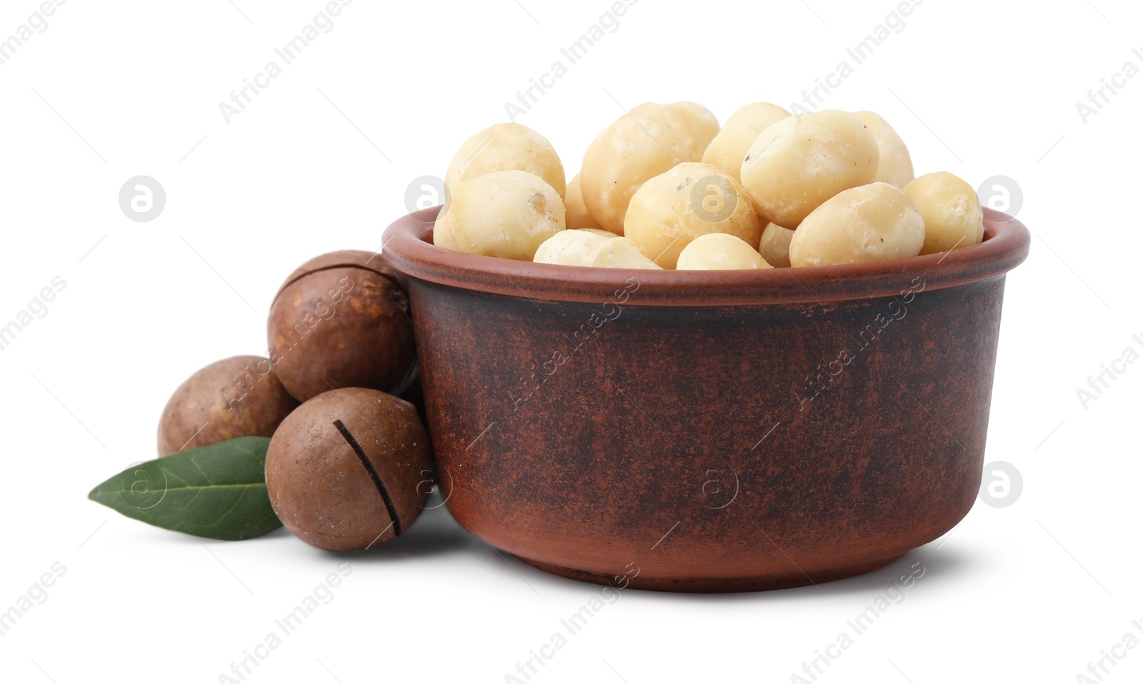 Photo of Macadamia nuts in bowl isolated on white