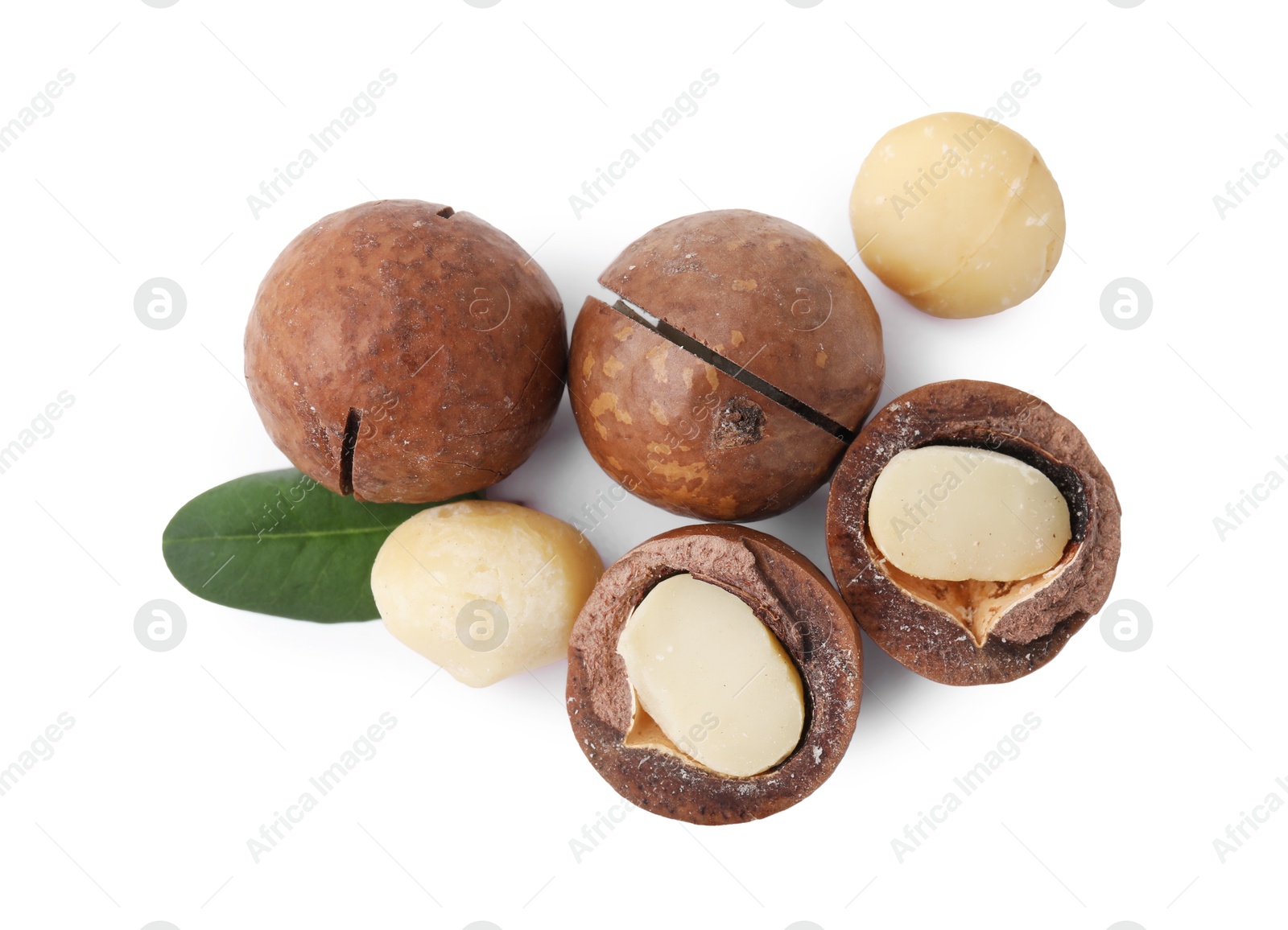 Photo of Macadamia nuts with shells isolated on white, top view