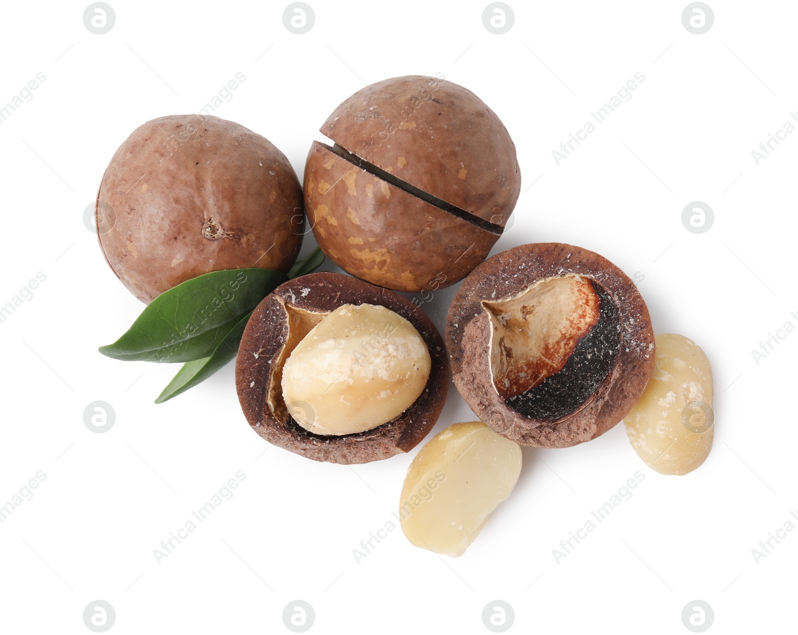 Photo of Macadamia nuts with shells isolated on white, top view