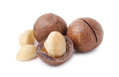 Photo of Macadamia nuts with shells isolated on white