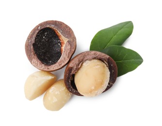 Photo of Macadamia nuts with shells isolated on white, top view