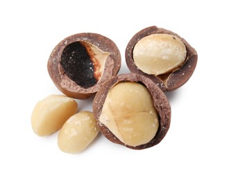 Photo of Macadamia nuts with shells isolated on white