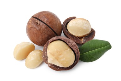 Photo of Macadamia nuts with shells isolated on white