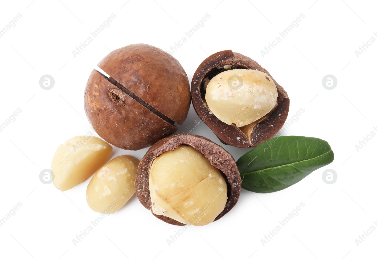 Photo of Macadamia nuts with shells isolated on white, top view