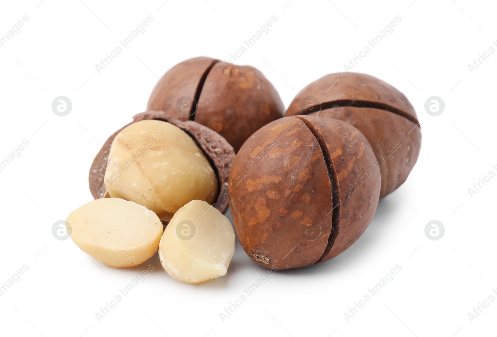 Photo of Macadamia nuts with shells isolated on white