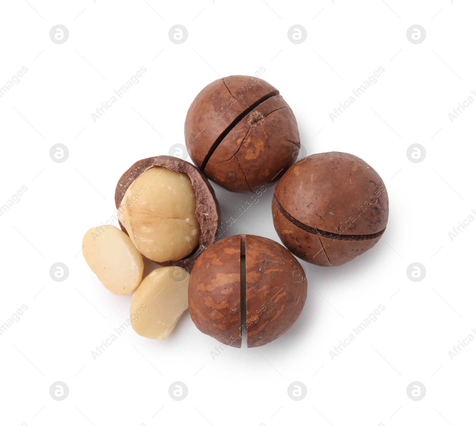 Photo of Macadamia nuts with shells isolated on white, top view