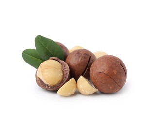 Photo of Macadamia nuts with shells isolated on white