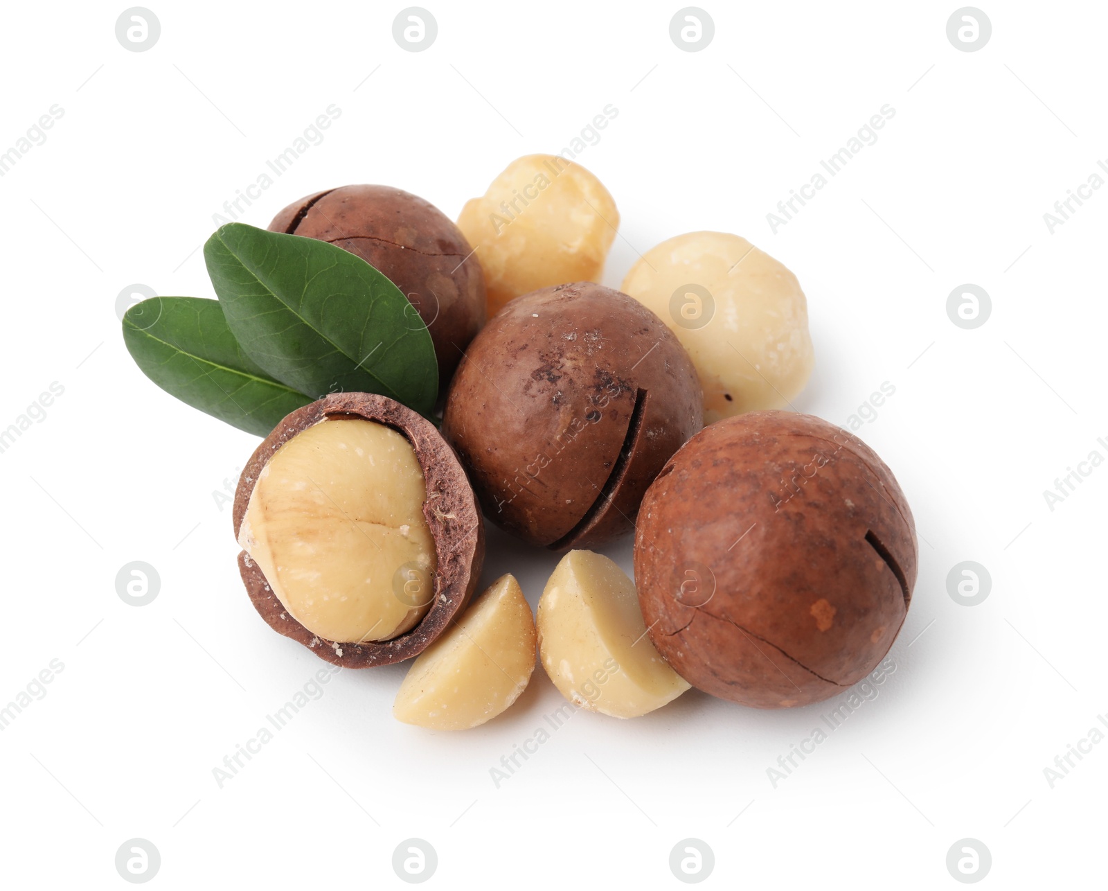 Photo of Macadamia nuts with shells isolated on white