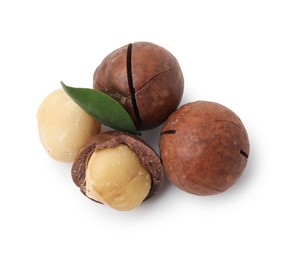 Photo of Macadamia nuts with shells isolated on white, top view