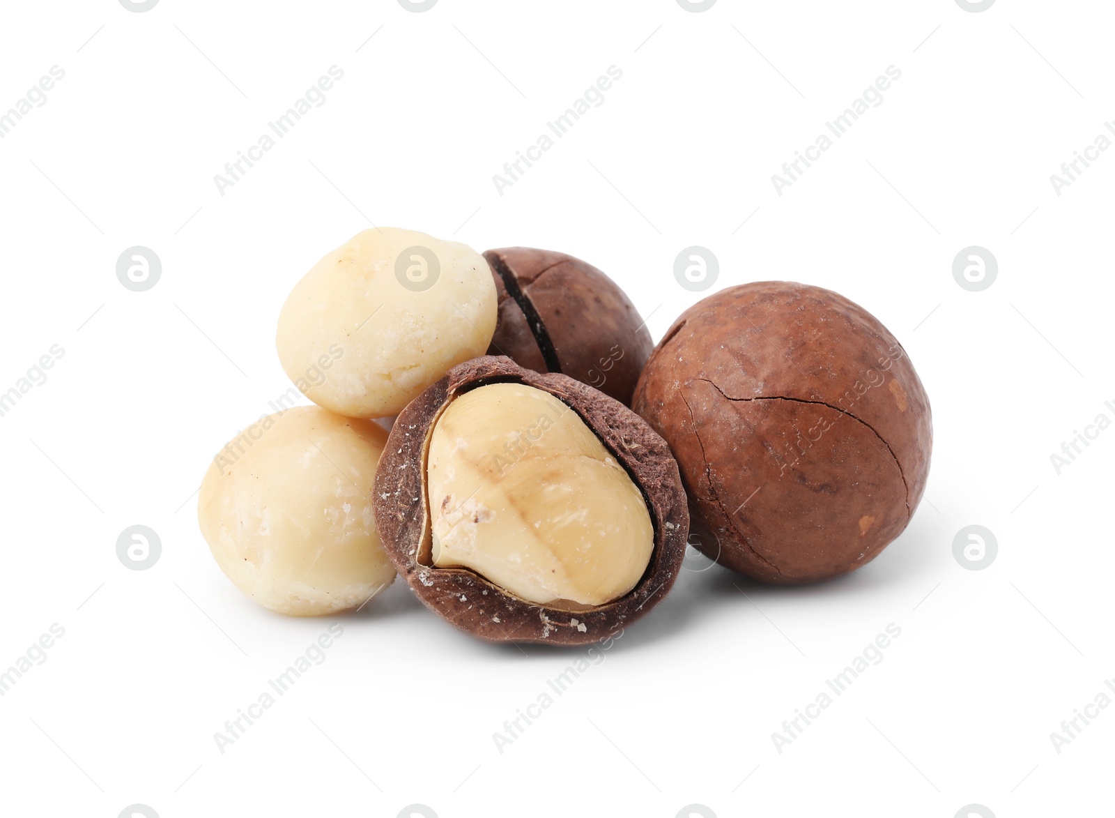 Photo of Macadamia nuts with shells isolated on white