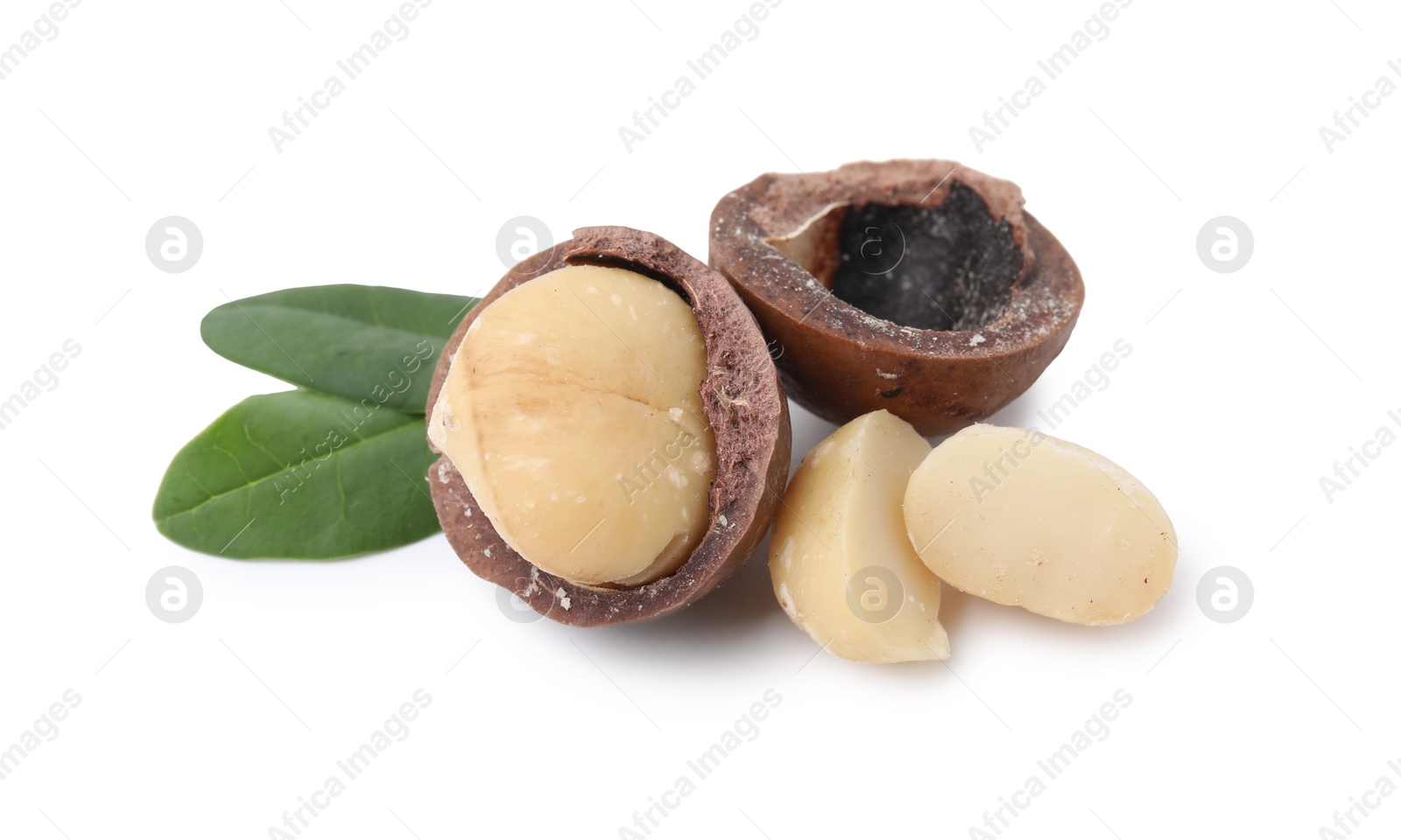 Photo of Macadamia nuts with shells isolated on white