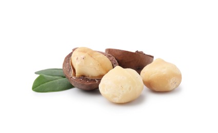 Photo of Macadamia nuts with shells isolated on white