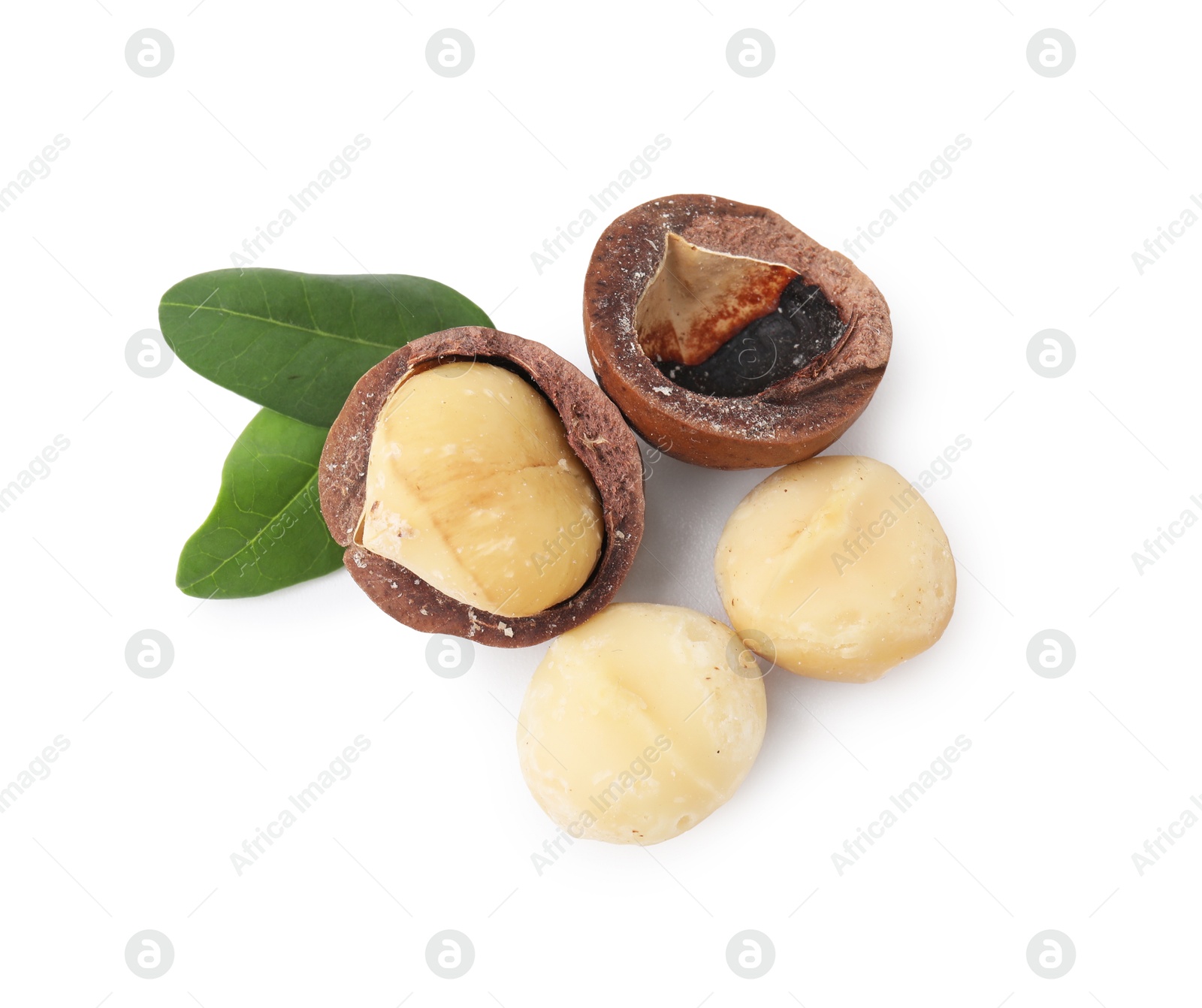 Photo of Macadamia nuts with shells isolated on white, top view