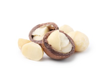 Photo of Macadamia nuts with shells isolated on white