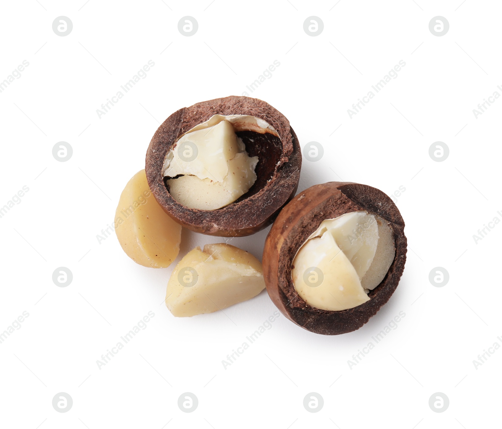 Photo of Macadamia nuts with shells isolated on white, top view